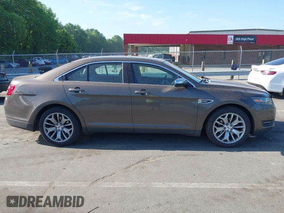 2016 Ford Taurus Limited z VIN 1FAHP2F81GG109548, wystawiony jako IAAI lot #42177871 z przebiegiem 168 611 mil mil oraz . Historia ofert i sprzedaży dostępna na DreamBid. Obrazek 13.