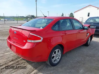 2008 Ford Focus SE with VIN 1FAHP35N58W219099, listed as a IAAI auction lot 42059347 with 209,309 mi miles. Bid and sale history available at carsss.com. Image 4.