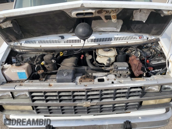 1995 Chevrolet Chevy Van с VIN 1GBEG25K1SF128372, выставлен на аукционе Copart как лот 78600654 с пробегом 183 522 миль миль и Списание • Salvage title. История ставок и продаж доступна на DreamBid. Изображение 12.