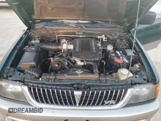 1999 Mitsubishi Montero Limited z VIN JA4LS41RXXP010154, wystawiony jako Copart lot #77666734 z przebiegiem Nie podano mil oraz Szkoda całkowita • Salvage title. Historia ofert i sprzedaży dostępna na DreamBid. Obrazek 12.