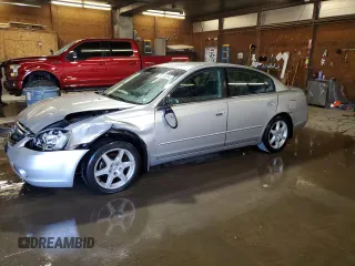 2003 Nissan Altima SE z VIN 1N4BL11DX3C327621, wystawiony jako Copart lot #79838514 z przebiegiem 110 509 mil mil oraz Szkoda całkowita • Salvage title. Historia ofert i sprzedaży dostępna na DreamBid. Obrazek 1.