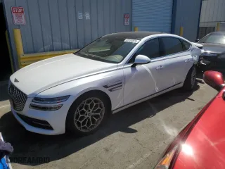 2023 Genesis G80 2.5T with VIN KMTGB4SC5PU142775, listed as a Copart auction lot 69104824 with 30,223 mi miles and Salvage Title. Bid and sale history available at carsss.com. Image 1.