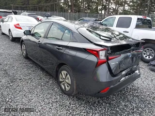 2021 Toyota Prius L Eco with VIN JTDKAMFU2M3143138, listed as a IAAI auction lot 41658263 with 102,718 mi miles. Bid and sale history available at carsss.com. Image 3.