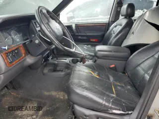 1997 Jeep Grand Cherokee Limited with VIN 1J4GZ78Y1VC706353, listed as a Copart auction lot 41437085 with 163,675 mi miles and Salvage Title. Bid and sale history available at carsss.com. Image 7.