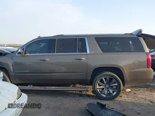 2015 Chevrolet Suburban LTZ with VIN 1GNSKKKC1FR628182, listed as a IAAI auction lot 41801391 with Not Provided miles and . Bid and sale history available at DreamBid. Image 14.