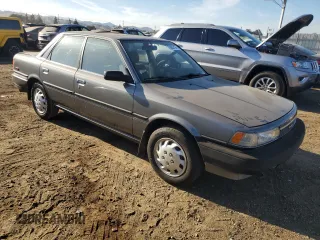 1989 Toyota Camry z VIN JT2SV21E8K0314703, wystawiony jako Copart lot #76053194 z przebiegiem 124 873 mil mil oraz Nie do naprawy • Non repairable. Historia ofert i sprzedaży dostępna na DreamBid. Obrazek 4.