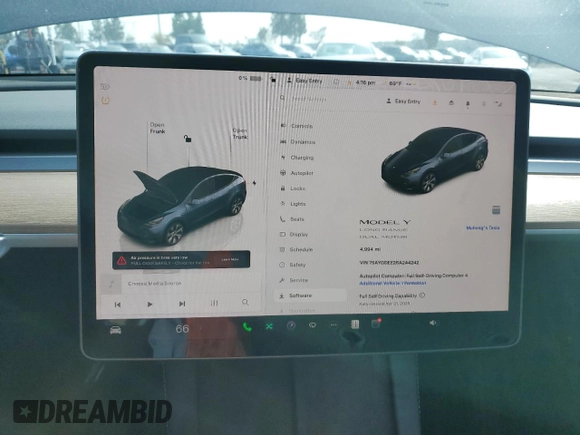 2024 Tesla Model Y Long Range with VIN 7SAYGDEE2RA244242, listed as a Copart auction lot 52635095 with 4,994 mi miles and Salvage title. Bid and sale history available at DreamBid. Image 9.