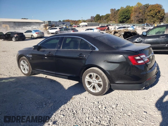 2015 Ford Taurus SEL with VIN 1FAHP2E90FG148821, listed as a Copart auction lot 77557384 with 141,514 mi miles and Salvage Title. Bid and sale history available at DreamBid. Image 2.