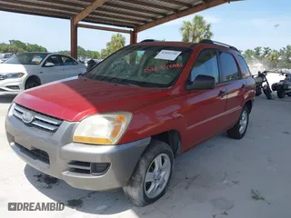 2007 Kia Sportage LX with VIN KNDJF724477440302, listed as a IAAI auction lot 42095210 with 115,854 mi miles. Bid and sale history available at carsss.com. Image 2.