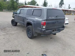 2021 Toyota Tacoma SR5 with VIN 3TMDZ5BN1MM119711, listed as a IAAI auction lot 42479038 with 64,779 mi miles and . Bid and sale history available at DreamBid. Image 3.