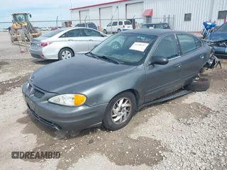 2004 Pontiac Grand Am SE1 with VIN 1G2NF52E64C257019, listed as a IAAI auction lot 42248217 with 164,581 mi miles and . Bid and sale history available at DreamBid. Image 2.