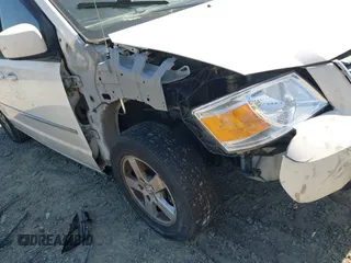 2010 Dodge Grand Caravan SXT with VIN 2D4RN5D12AR210330, listed as a IAAI auction lot 42146969 with 233,607 mi miles and . Bid and sale history available at DreamBid. Image 6.