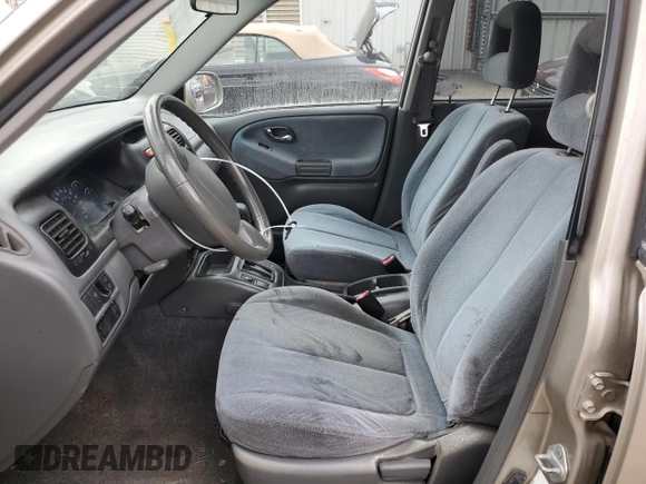 2002 Suzuki XL7 Standard z VIN JS3TY92V524101048, wystawiony jako Copart lot #77658264 z przebiegiem 226 279 mil mil oraz Szkoda całkowita • Salvage title. Historia ofert i sprzedaży dostępna na DreamBid. Obrazek 7.