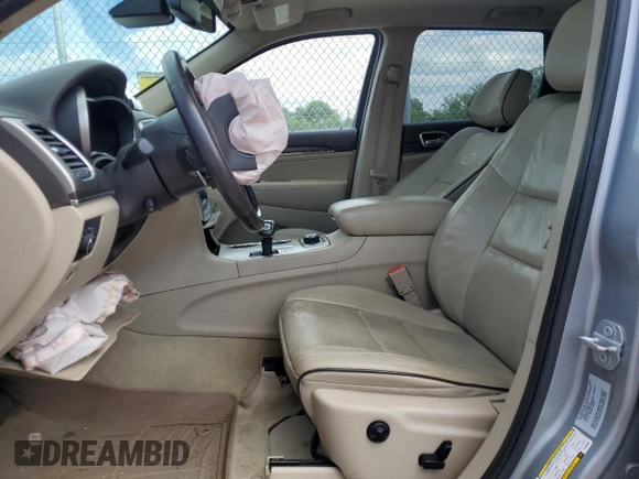 2015 Jeep Grand Cherokee Overland with VIN 1C4RJFCG3FC880084, listed as a Copart auction lot 57291165 with 112,442 mi miles and Salvage title. Bid and sale history available at DreamBid. Image 7.
