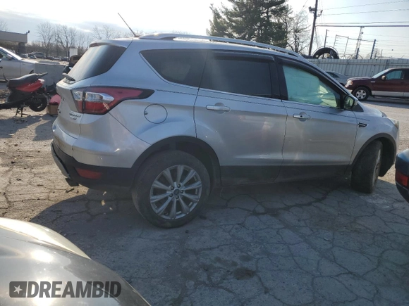 2017 Ford Escape Titanium with VIN 1FMCU9J95HUA48080, listed as a Copart auction lot 83202034 with 122,528 mi miles and Salvage Title. Bid and sale history available at carsss.com. Image 3.