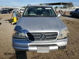 2000 Mercedes-Benz M-Class with VIN 4JGAB54E6YA181947, listed as a Copart auction lot 77781524 with 165,399 mi miles and Salvage Title. Bid and sale history available at carsss.com. Image 5.
