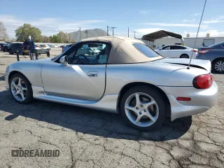 2003 Mazda MX-5 Miata Cloth z VIN JM1NB353430301685, wystawiony jako Copart lot #48756715 z przebiegiem 57 414 mil mil oraz Szkoda całkowita • Salvage title. Historia ofert i sprzedaży dostępna na DreamBid. Obrazek 2.