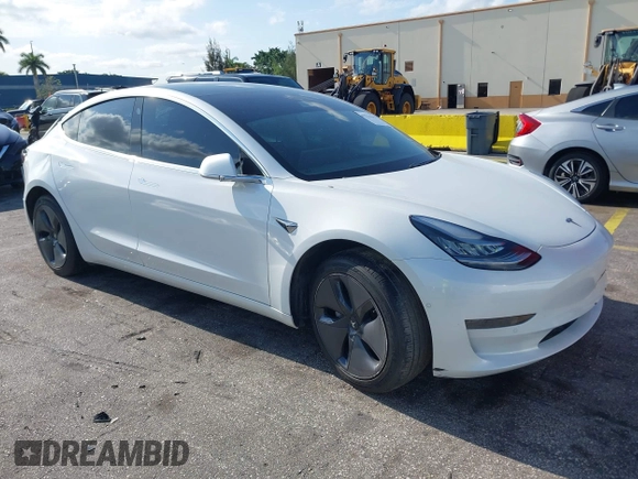 2020 Tesla Model 3 Standard Range Plus with VIN 5YJ3E1EA6LF799620, listed as a IAAI auction lot 42221643 with 55,458 mi miles and . Bid and sale history available at carsss.com. Image 1.