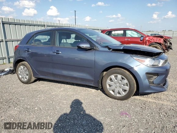2023 Kia Rio S with VIN 3KPA25AD5PE548218, listed as a Copart auction lot 71808674 with 24,412 mi miles and Salvage Title. Bid and sale history available at DreamBid. Image 4.