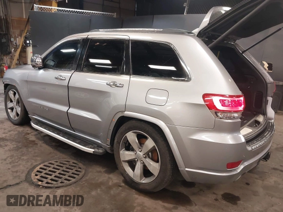 2015 Jeep Grand Cherokee Overland with VIN 1C4RJFCG1FC215426, listed as a IAAI auction lot 41689821 with 128,563 mi miles. Bid and sale history available at carsss.com. Image 3.