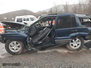 2002 Jeep Grand Cherokee Laredo with VIN 1J4GW48S82C321712, listed as a IAAI auction lot 41855809 with 1 mi miles. Bid and sale history available at carsss.com. Image 17.