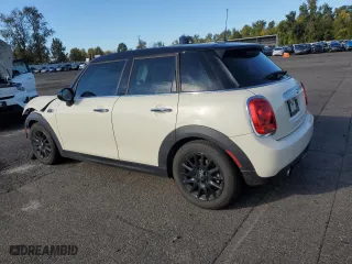 2015 MINI Cooper Hardtop 4 Door with VIN WMWXS5C59FT830039, listed as a Copart auction lot 77198974 with 43,277 mi miles and Salvage Title. Bid and sale history available at carsss.com. Image 2.