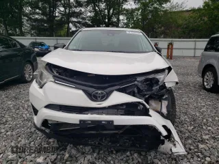 2018 Toyota RAV4 LE with VIN 2T3BFREV3JW764258, listed as a Copart auction lot 61234155 with Not provided miles and Salvage title. Bid and sale history available at DreamBid. Image 5.
