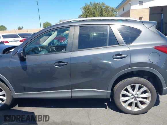 2014 Mazda CX-5 Grand Touring with VIN JM3KE4DY8E0391317, listed as a IAAI auction lot 41871641 with 77,048 mi miles. Bid and sale history available at carsss.com. Image 14.