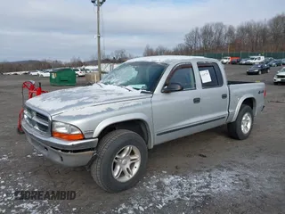 2004 Dodge Dakota SLT with VIN 1D7HG48N04S603763, listed as a IAAI auction lot 41607984 with 157,360 mi miles. Bid and sale history available at carsss.com. Image 2.