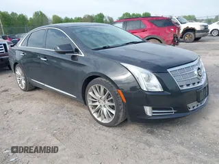 2013 Cadillac XTS Platinum z VIN 2G61U5S35D9200948, wystawiony jako IAAI lot #42233045 z przebiegiem 74 965 mil mil oraz . Historia ofert i sprzedaży dostępna na DreamBid. Obrazek 1.