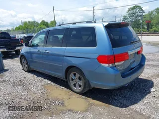 2010 Honda Odyssey Touring with VIN 5FNRL3H93AB058240, listed as a IAAI auction lot 42211192 with 223,859 mi miles and . Bid and sale history available at DreamBid. Image 3.
