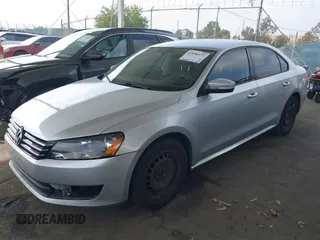 2015 Volkswagen Passat 1.8T Limited Edition with VIN 1VWAT7A34FC077021, listed as a IAAI auction lot 42090573 with 230,465 mi miles. Bid and sale history available at carsss.com. Image 2.