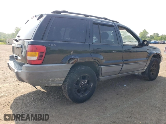 2000 Jeep Grand Cherokee Laredo with VIN 1J4GW48S6YC404063, listed as a Copart auction lot 59442725 with 268,543 mi miles and Salvage title. Bid and sale history available at DreamBid. Image 3.