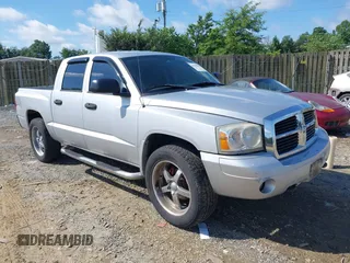 2006 Dodge Dakota SLT z VIN 1D7HE48K76S610868, wystawiony jako IAAI lot #42542808 z przebiegiem 244 951 mil mil oraz . Historia ofert i sprzedaży dostępna na DreamBid. Obrazek 1.