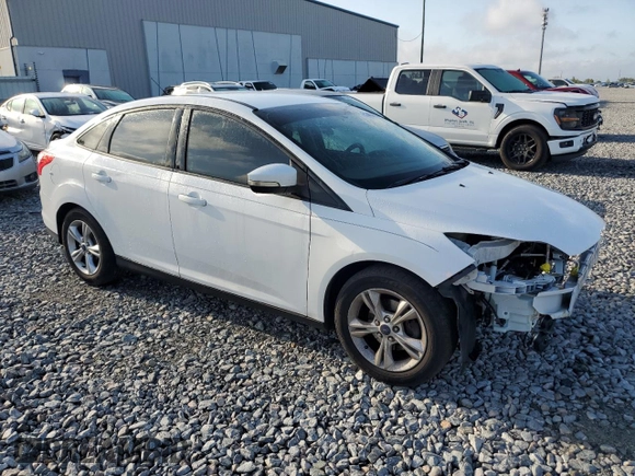 2014 Ford Focus SE with VIN 1FADP3F27EL412368, listed as a Copart auction lot 51463155 with 143,484 mi miles and Salvage Title. Bid and sale history available at DreamBid. Image 4.