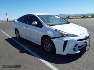 2021 Toyota Prius L Eco with VIN JTDKAMFU9M3133528, listed as a IAAI auction lot 41950856 with 138,787 mi miles. Bid and sale history available at carsss.com. Image 1.