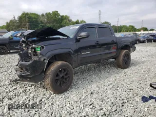 2020 Toyota Tacoma SR5 with VIN 3TMCZ5AN0LM299243, listed as a Copart auction lot 58818825 with 76,449 mi miles and Salvage title. Bid and sale history available at DreamBid. Image 1.