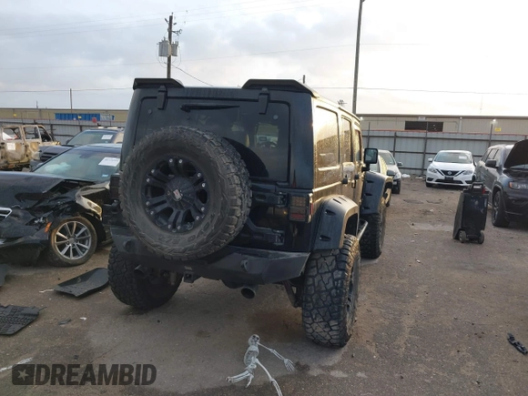 2013 Jeep Wrangler Unlimited Rubicon with VIN 1C4BJWFG2DL531203, listed as a IAAI auction lot 40729064 with 84,296 mi miles. Bid and sale history available at carsss.com. Image 4.