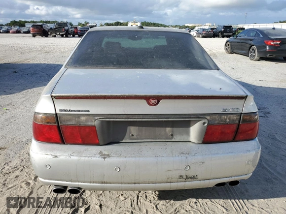 2003 Cadillac Seville Touring STS z VIN 1G6KY54923U101998, wystawiony jako Copart lot #74029304 z przebiegiem 134 157 mil mil oraz Szkoda całkowita • Salvage title. Historia ofert i sprzedaży dostępna na DreamBid. Obrazek 6.