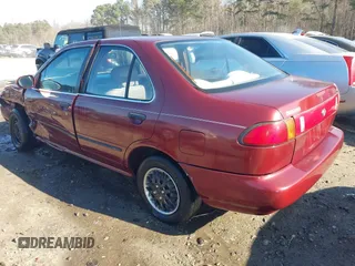 1996 Nissan Sentra XE z VIN 1N4AB41D7TC770549, wystawiony jako IAAI lot #41160561 z przebiegiem 180 485 mil mil oraz . Historia ofert i sprzedaży dostępna na DreamBid. Obrazek 3.