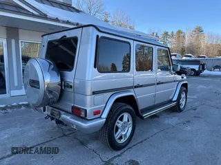 2003 Mercedes-Benz G-Class with VIN WDCYR49E23X141382, listed as a IAAI auction lot 41654677 with 329,762 mi miles. Bid and sale history available at carsss.com. Image 4.