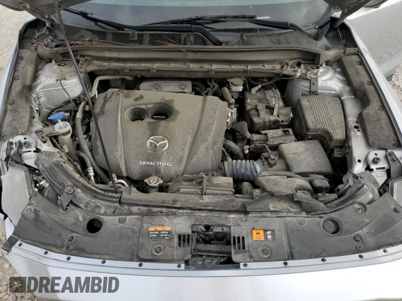 2021 Mazda CX-5 Grand Touring with VIN JM3KFADM8M1339008, listed as a Copart auction lot 49150115 with 144,851 mi miles and Salvage Title. Bid and sale history available at carsss.com. Image 12.