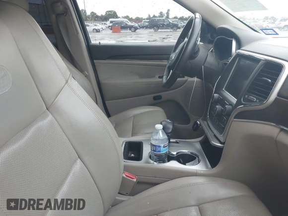 2015 Jeep Grand Cherokee Overland with VIN 1C4RJECG1FC769950, listed as a IAAI auction lot 42405712 with 217,514 mi miles and . Bid and sale history available at DreamBid. Image 5.