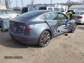 2018 Tesla Model 3 Long Range Battery with VIN 5YJ3E1EB5JF063077, listed as a IAAI auction lot 41773551 with 99,477 mi miles and . Bid and sale history available at DreamBid. Image 4.