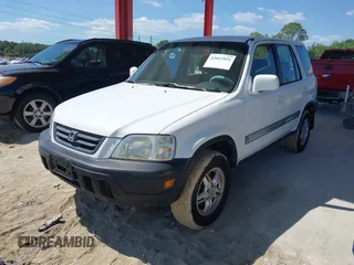 1999 Honda CR-V EX with VIN JHLRD1860XC037846, listed as a IAAI auction lot 42037921 with 164,477 mi miles. Bid and sale history available at carsss.com. Image 2.