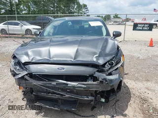 2020 Ford Fusion SE z VIN 3FA6P0HD6LR160147, wystawiony jako IAAI lot #42499983 z przebiegiem 73 971 mil mil oraz . Historia ofert i sprzedaży dostępna na DreamBid. Obrazek 6.