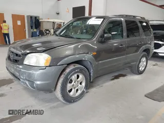 2002 Mazda Tribute LX with VIN 4F2CU08132KM39554, listed as a IAAI auction lot 42015060 with 99,128 mi miles and . Bid and sale history available at carsss.com. Image 2.