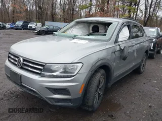2021 Volkswagen Tiguan SE with VIN 3VV2B7AX8MM100651, listed as a IAAI auction lot 41803931 with 69,405 mi miles and . Bid and sale history available at DreamBid. Image 2.