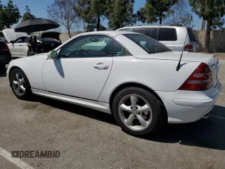 2001 Mercedes-Benz SLK-Class with VIN WDBKK65F81F210099, listed as a Copart auction lot 52606105 with 129,849 mi miles and Salvage Title. Bid and sale history available at carsss.com. Image 2.