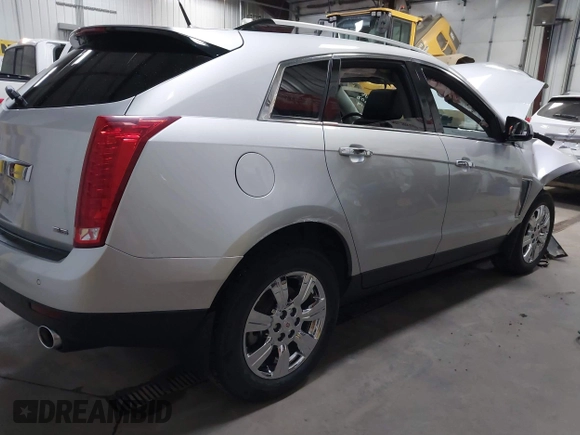 2014 Cadillac SRX Luxury Collection z VIN 3GYFNEE36ES679505, wystawiony jako IAAI lot #41817608 z przebiegiem 62 351 mil mil oraz . Historia ofert i sprzedaży dostępna na DreamBid. Obrazek 4.